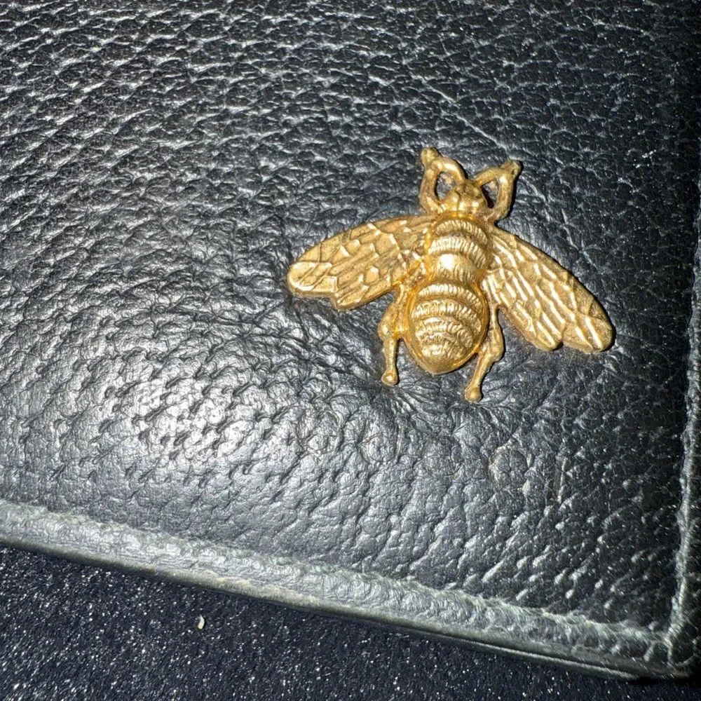 Brand new men’s Gucci Black Leather Wallet with Gold Bee Accent comes with box